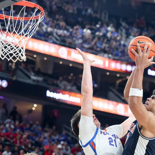Arizona forward Koa Peat (10) shoots against Florida forward Alex Condon (21) during the second half of an NCAA college basketball game, Monday, Nov. 3, 2025, in Las Vegas. (AP Photo/Ian Maule)