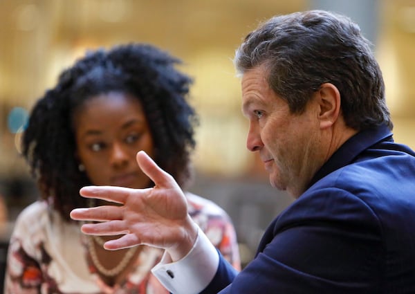 Rick Jackson meets with two former foster children including Crystal Williams (left) at the Sloppy Floyd Building in January 2014 before heading to the Capitol for a meeting with lawmakers. (Bob Andres/AJC 2014)