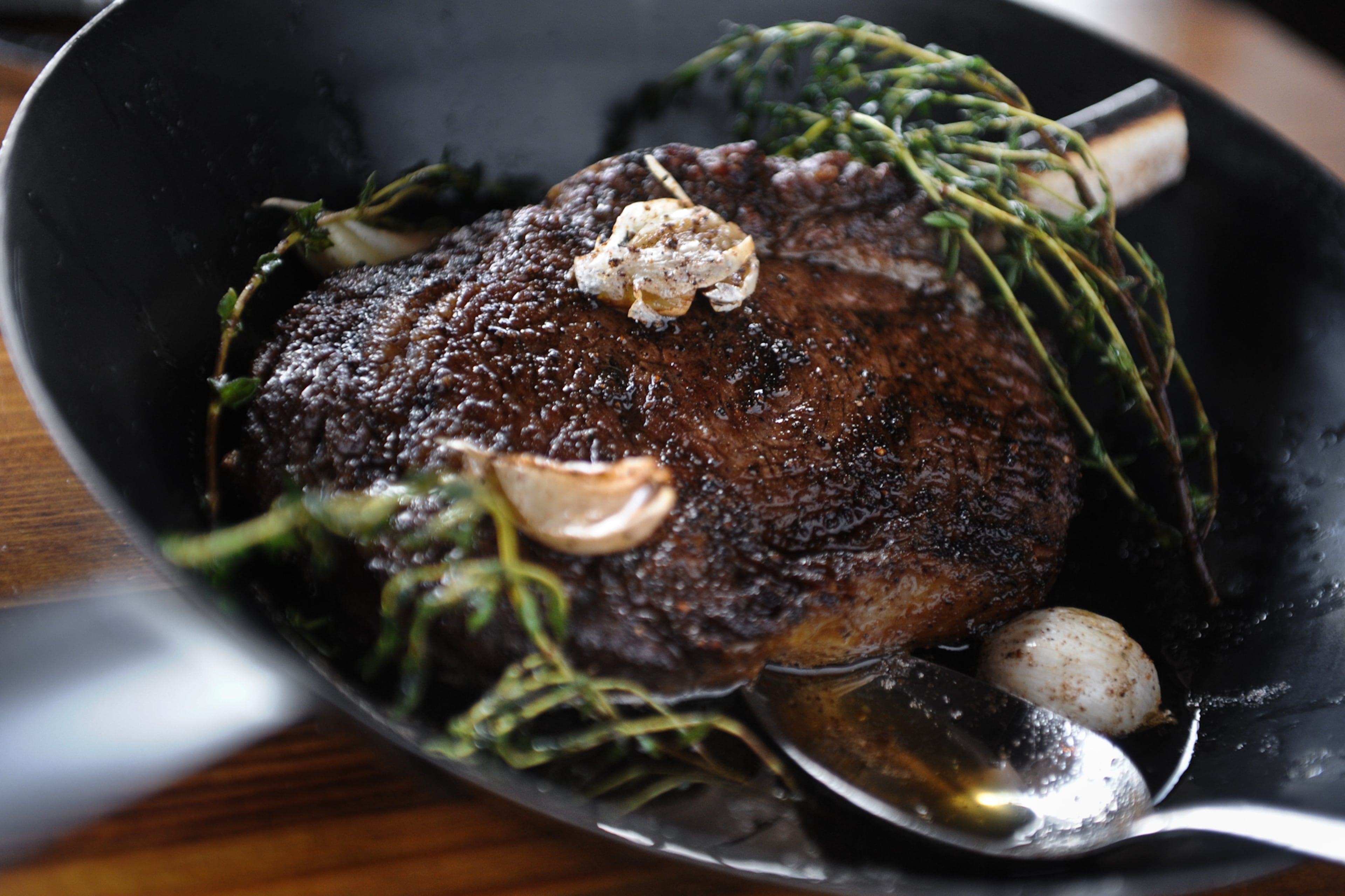 Little Alley delivers a rock-solid experience, including the dry-aged Bone-in Ribeye Steak. (Becky Stein for the AJC)
