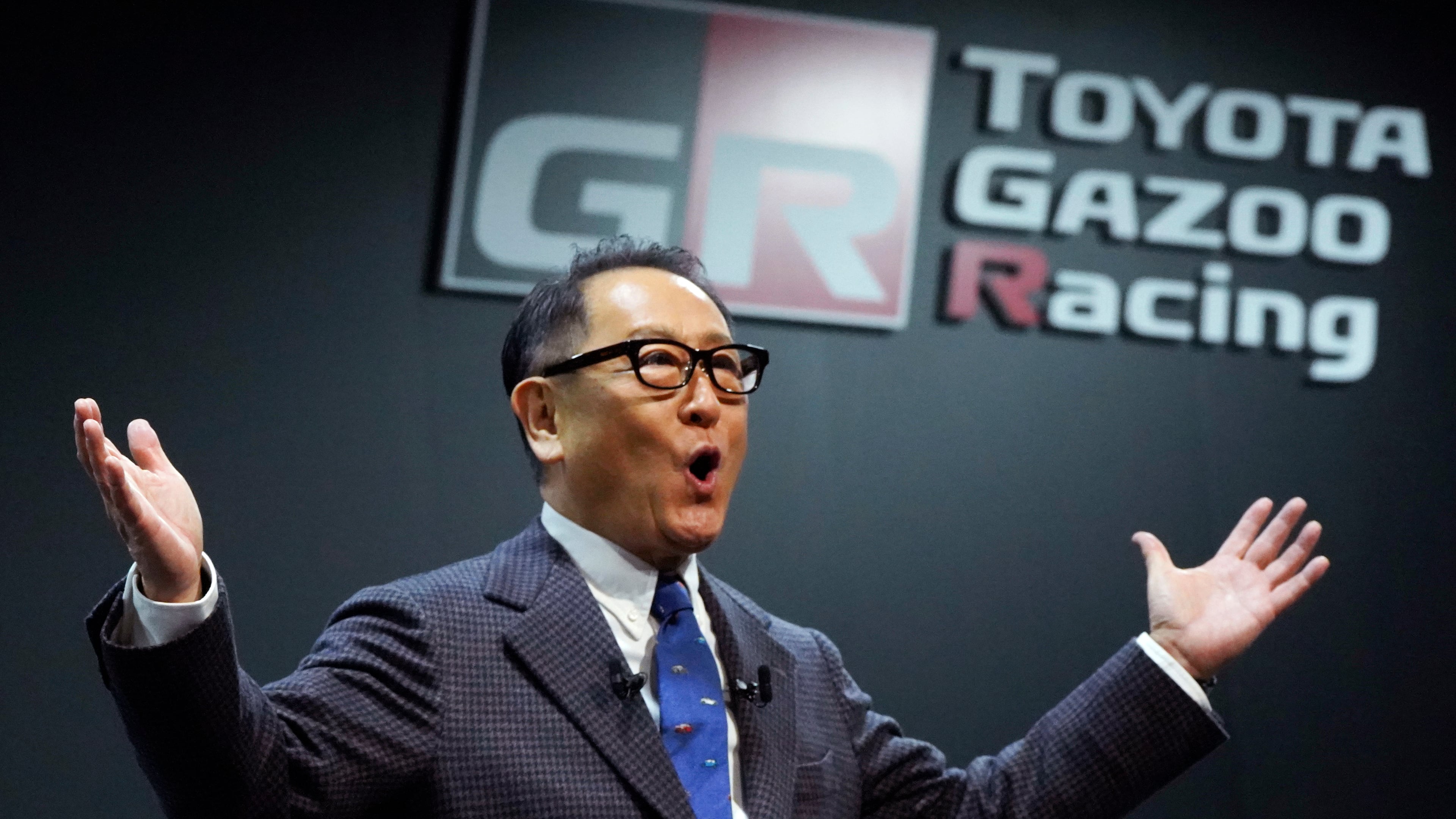 FILE - Then Toyota Motor Corp. Chief Executive Akio Toyoda delivers a speech on the stage at the Tokyo Auto Salon, an industry event similar to the world's auto shows on Jan. 13, 2023, in Chiba near Tokyo. (AP Photo/Eugene Hoshiko, File)