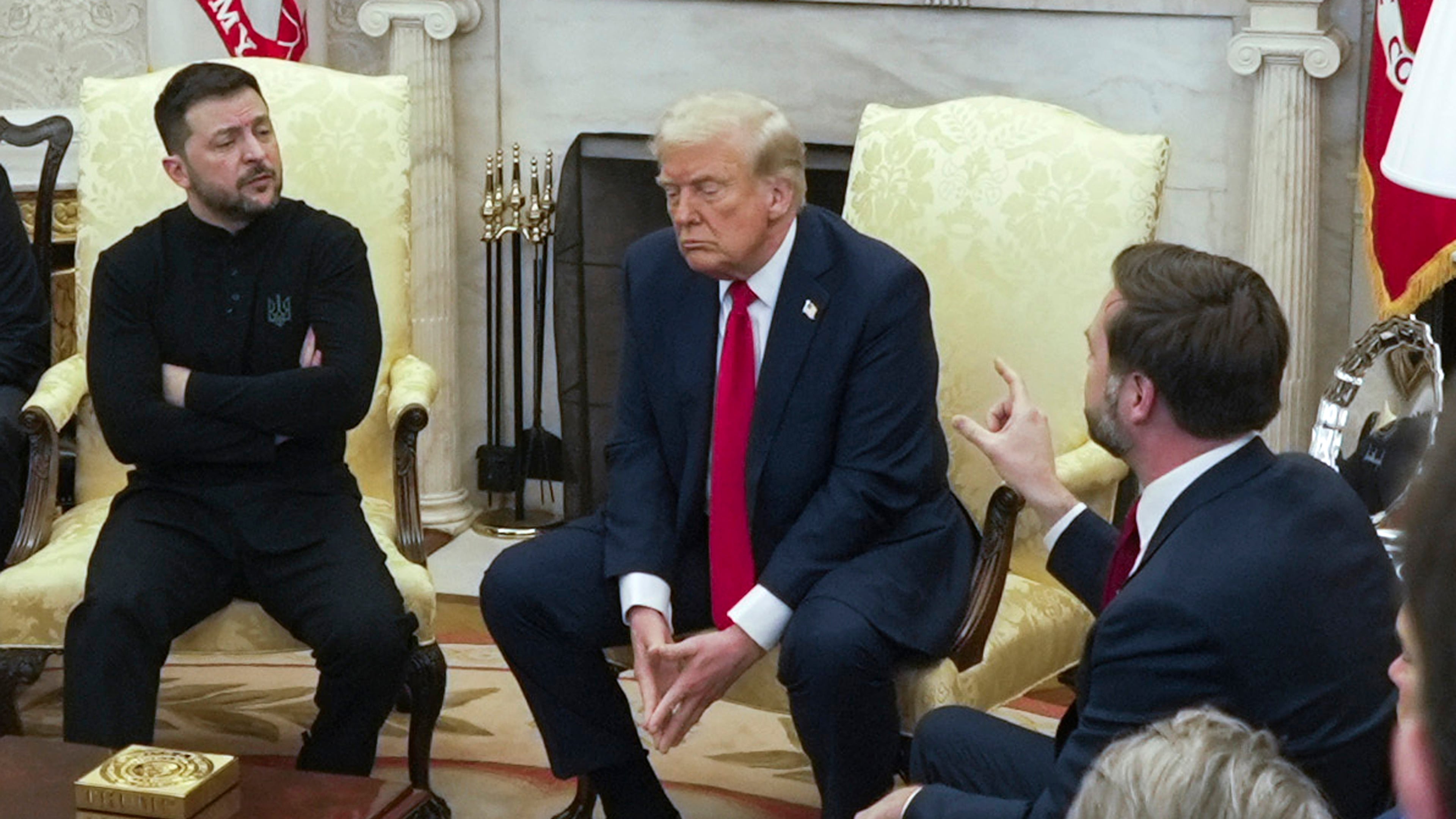 FILE - Vice President JD Vance, right, speaks with Ukrainian President Volodymyr Zelenskyy, left, as President Donald Trump listens in the Oval Office at the White House, Feb. 28, 2025, in Washington. (AP Photo/ Mystyslav Chernov, File)