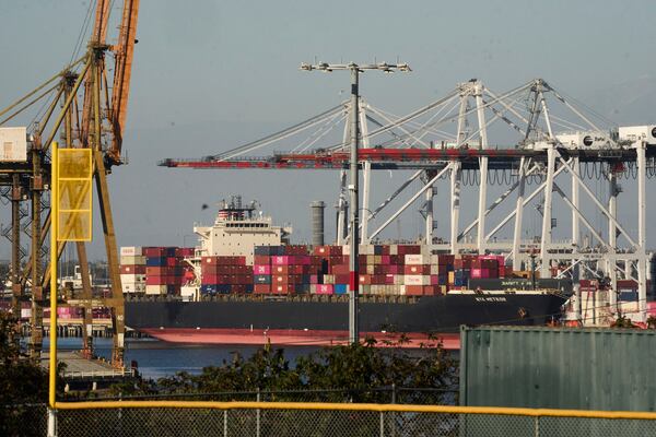 The NYK Meteor container ship is moored at the Port of Los Angeles, Wednesday, April 9, 2025, in Los Angeles. (AP Photo/Damian Dovarganes)