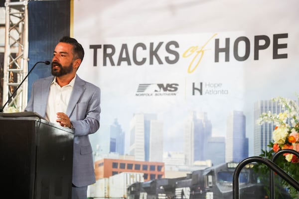 CEO of Hope Atlanta Julio Carrillo speaks during Tracks of Hope, an event hosted by Norfolk Southern in support of Hope Atlanta. Carrillo says the company has been an immense support to Hope Atlanta, and even if the merger happens “we hope that they still have a team here in Atlanta." (Abbey Cutrer/AJC)