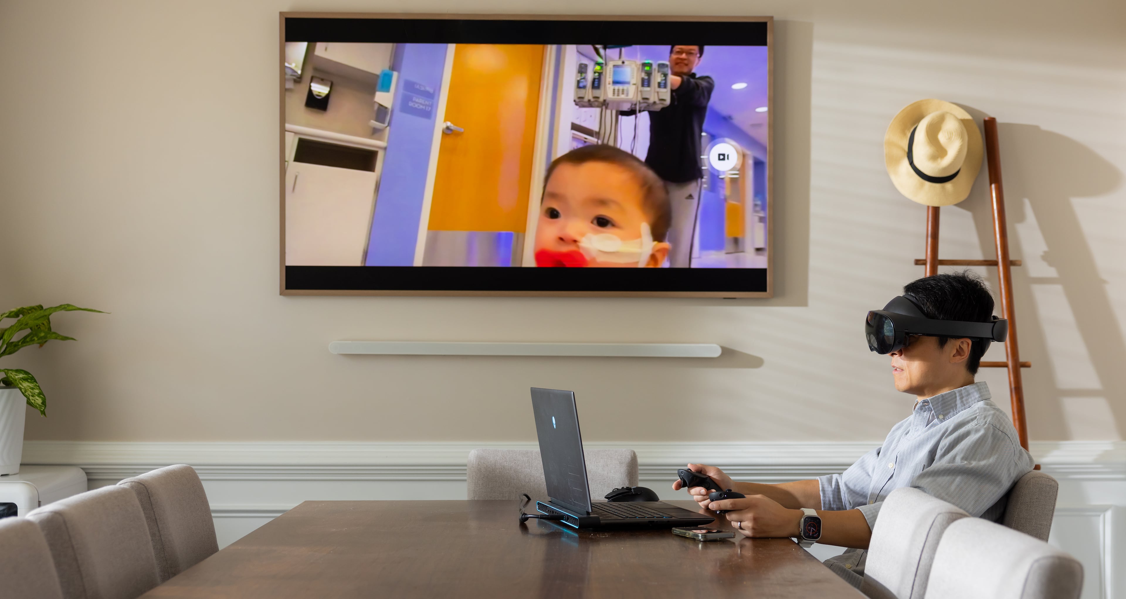 Kennesaw State University assistant professor of game development Lei Zhang presents his latest project. The virtual reality system is designed to aid parents in grief therapy. (Courtesy of Matt Yung/Kennesaw State University)