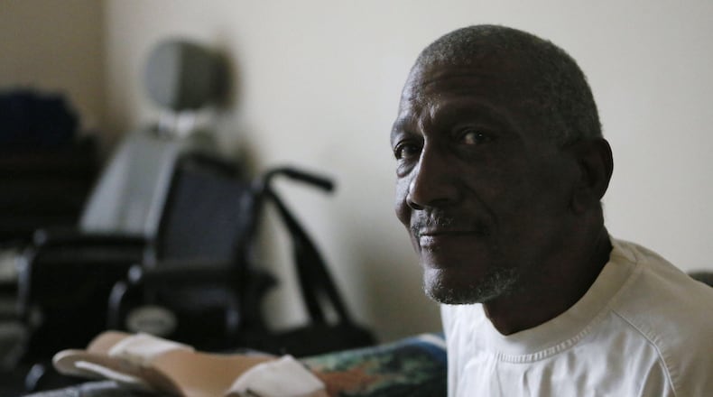 Harold Webster, seated in his apartment, has been on the wait list for meals on wheels since early January. He had a stroke late last year and has very limited movement on his left side, so is wary of cooking. He saw someone delivering Meals on Wheels, and decided to see if he could join. He lives on social security and did handyman work on the side. Now he can’t do that, so his income is lower. BOB ANDRES / BANDRES@AJC.COM