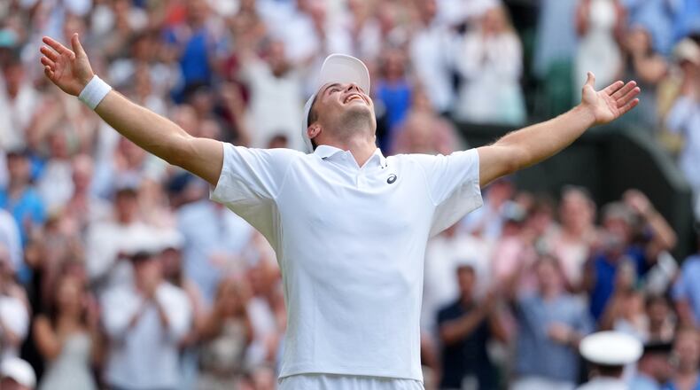 Arthur Fery of Britain celebrates winning the men's singles fourth round match against Grigor Dimitrov of Bulgaria at the Wimbledon Tennis Championships in London, Monday, July 6, 2026.(AP Photo/Kirsty Wigglesworth)