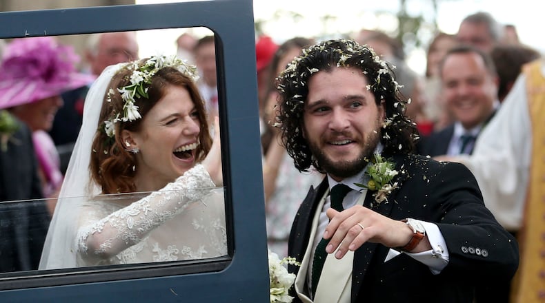 'Game of Thrones' actors Kit Harington and Rose Leslie celebrate as they leave after their wedding ceremony, at Rayne Church, Kirkton of Rayne in Aberdeenshire, Scotland, Saturday June 23, 2018.