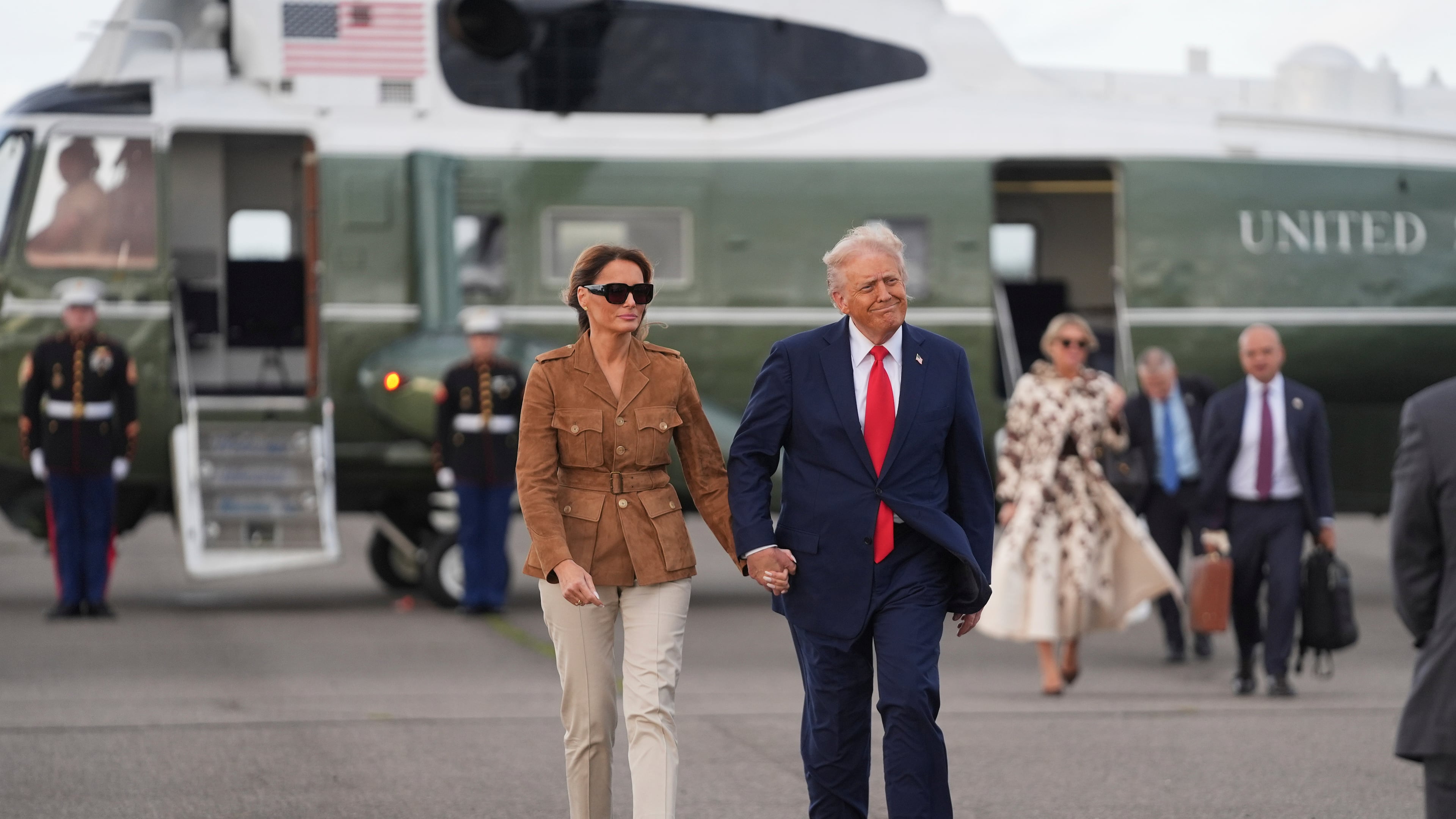 President Donald Trump and first lady Melania Trump walk after arriving on Marine One at Stansted Airport, Thursday, Sept. 18, 2025, in Stansted, England. (AP Photo/Evan Vucci)