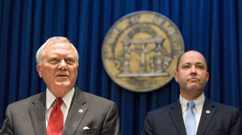 Gov. Nathan Deal and incoming Attorney General Chris Carr. (DAVID BARNES / DAVID.BARNES@AJC.COM)