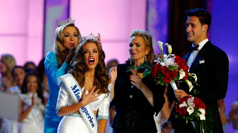 Miss America 2015 Kira Kazantsev crowns Miss Georgia Betty Cantrell as Miss America 2016, Sunday, Sept. 13, 2015, in Atlantic City, N.J. (AP Photo/Noah K. Murray)