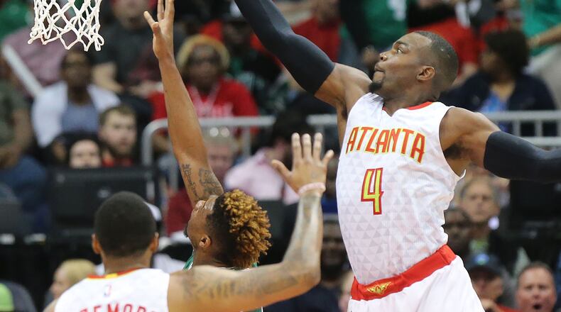 041916 ATLANTA: Hawks Paul Millsap goes up to block a shot by Celtics Marcus Smart during the second game in their NBA Eastern Conference first round playoff at Philips Arena on Tuesday, April 19, 2016. Curtis Compton / ccompton@ajc.com