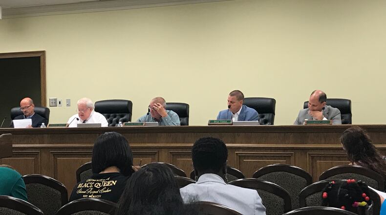 Phillip Beard, second from left, leads the meeting of the Buford City Commission on Tuesday, Sept. 4, 2018. It was the first commission meeting since an explosive tape surfaced of now-former city schools superintendent Geye Hamby using the n-word. TYLER ESTEP / TYLER.ESTEP@AJC.COM