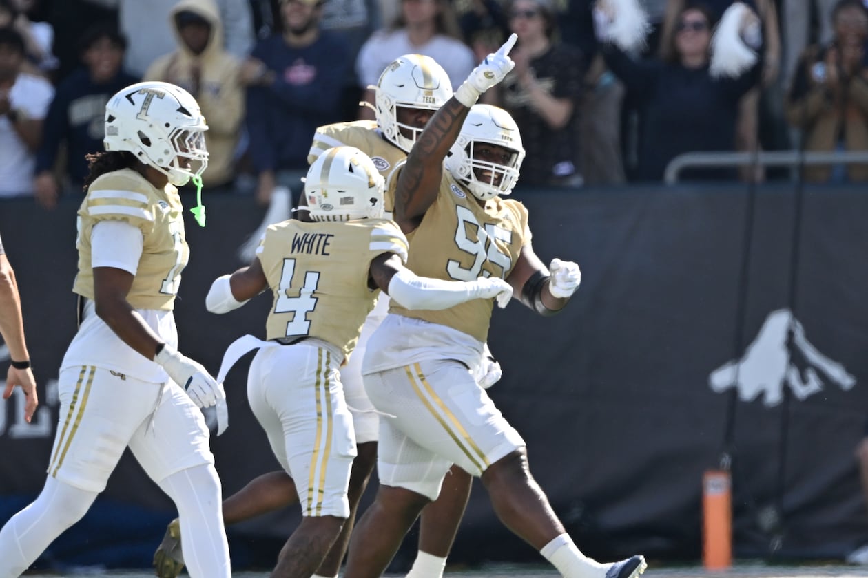 Georgia Tech defensive lineman Jason Moore (95) celebrates with teammates during the second half in an NCAA college football game at Bobby Dodd Stadium, Saturday, October 25, 2025, in Atlanta. Georgia Tech won 41-16 over Syracuse. (Hyosub Shin/AJC)