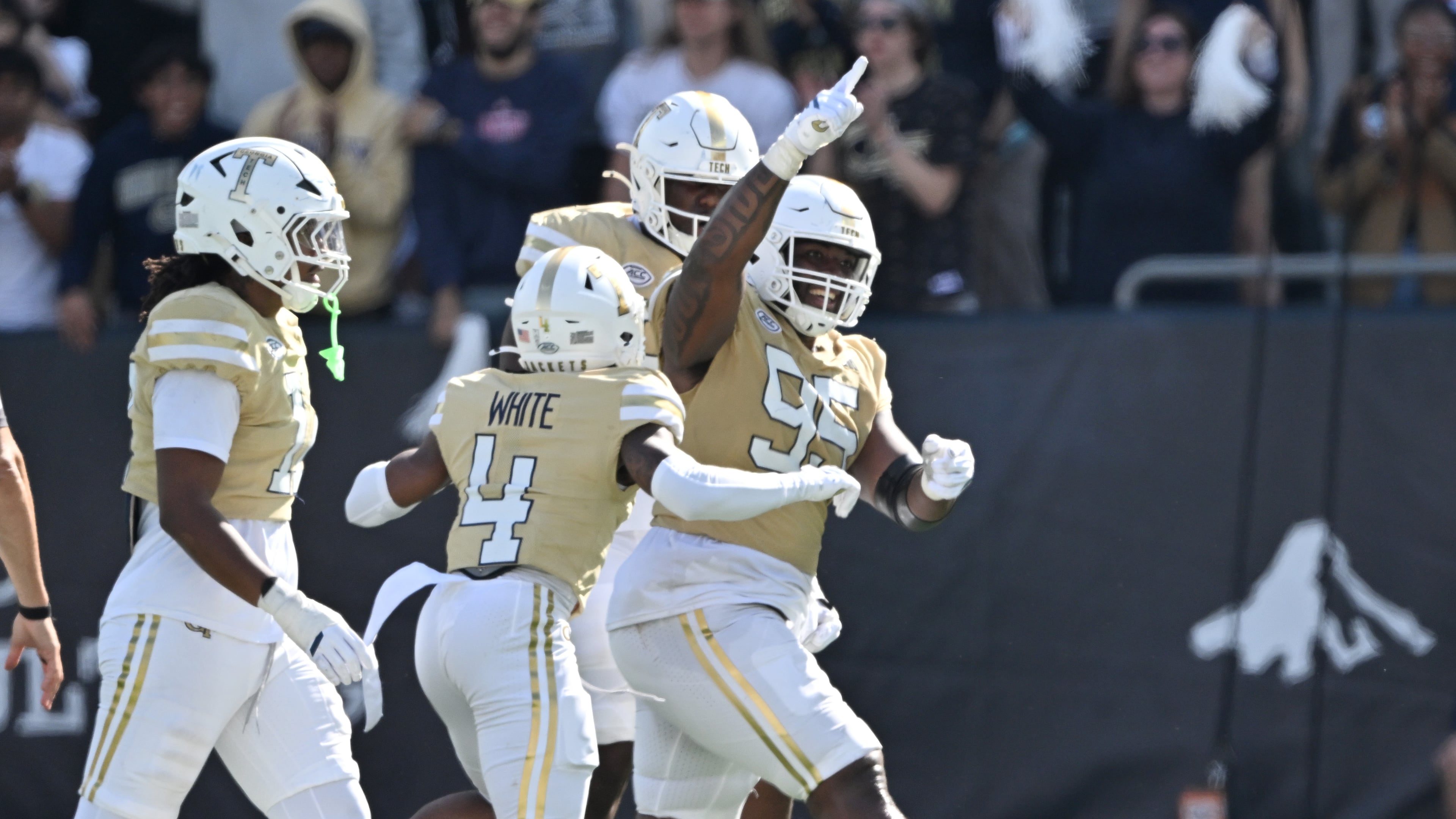 Georgia Tech defensive lineman Jason Moore (95) celebrates with teammates during the second half in an NCAA college football game at Bobby Dodd Stadium, Saturday, October 25, 2025, in Atlanta. Georgia Tech won 41-16 over Syracuse. (Hyosub Shin/AJC)