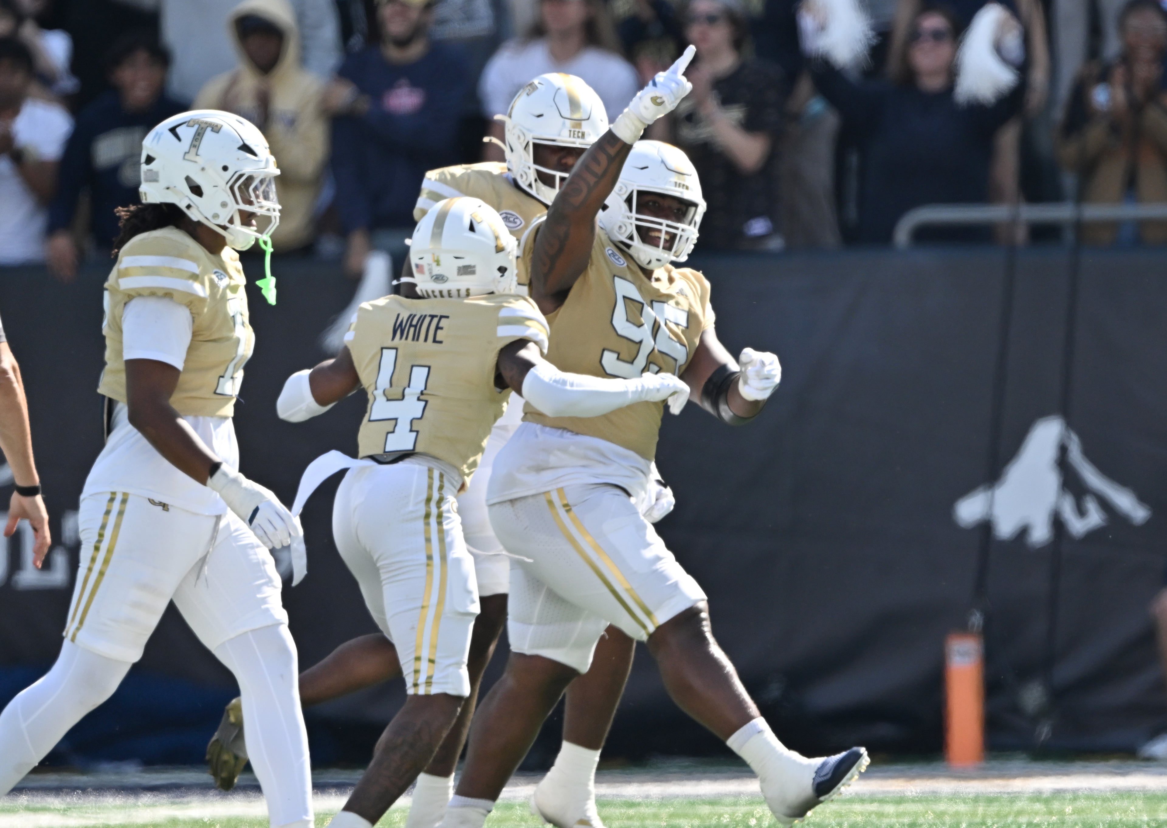 Georgia Tech defensive lineman Jason Moore (right) celebrates with teammates during the second half in an NCAA college football game at Bobby Dodd Stadium, Saturday, Oct. 25, 2025 in Atlanta. Georgia Tech won 41-16 over Syracuse. The Yellow Jackets are 8-0 for the first time since 1966 and 5-0 in the ACC for the first time ever. (Hyosub Shin/AJC)