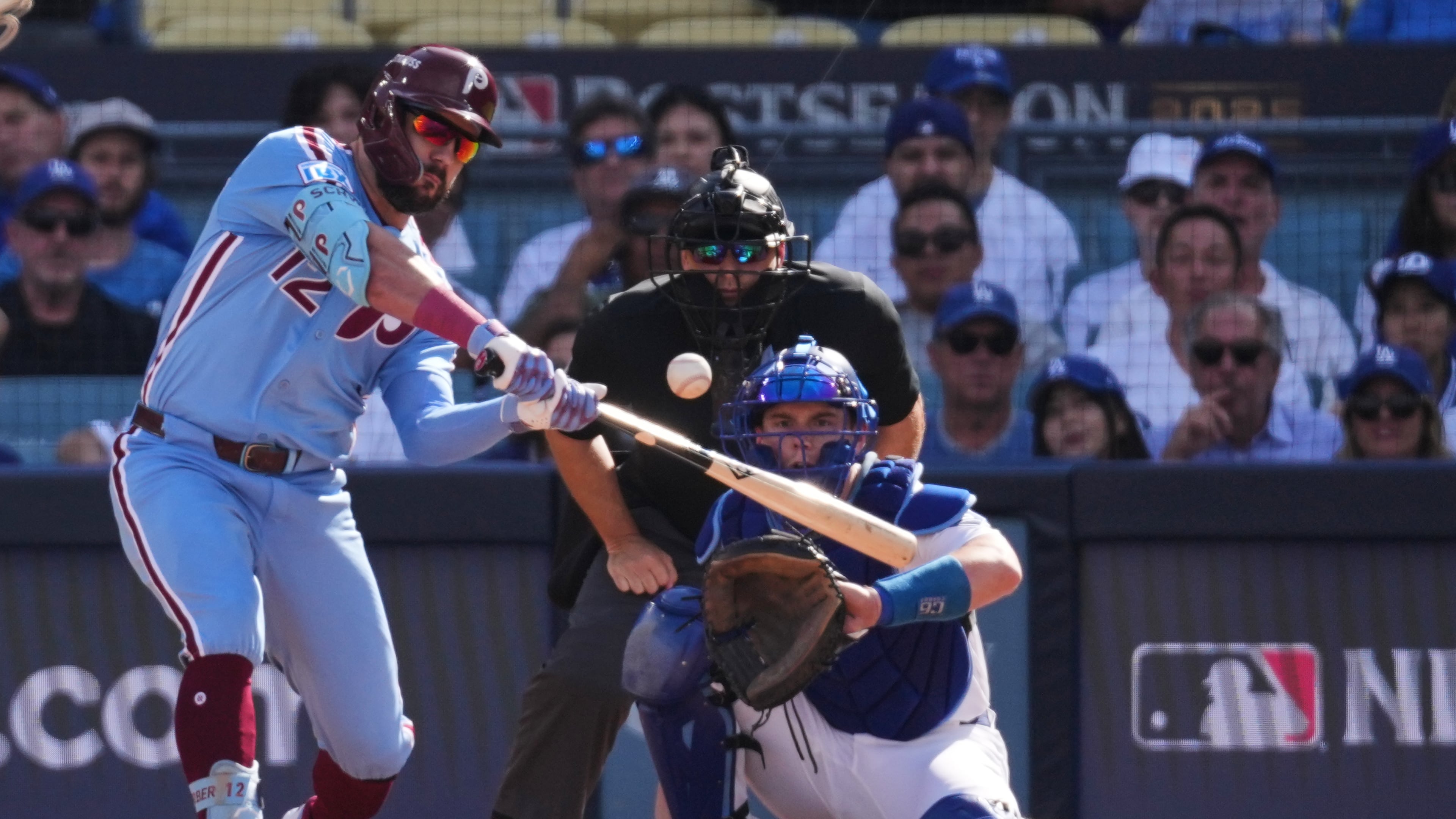 FILE - Philadelphia Phillies' Kyle Schwarber connects for a double during the first inning in Game 4 of baseball's National League Division Series against the Los Angeles Dodgers, Oct. 9, 2025, in Los Angeles. (AP Photo/Jae C. Hong, File)