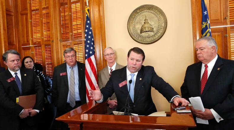 January 28, 2015 - Atlanta - House Transportation Committee Chairman Jay Roberts (at podium) and Speaker David Ralston (right), outlined the transportation plan at a news conference Wednesday afternoon. Behind them is Appropriations Committee Chairman Terry England (left), R - Auburn, Matt Hatchett, R - Dublin and Larry O`Neal, R - Bonaire. Republican leaders in the state House on Wednesday unveiled their plan for funding transportation improvements. Speaker David Ralston, R-Blue Ridge, along with House Transportation Committee Chairman Jay Roberts, R - Ocilla, outlined the plan at a news conference Wednesday afternoon. BOB ANDRES / BANDRES@AJC.COM House Transportation Committee Chairman Jay Roberts (at podium) and Speaker David Ralston (right), outlined the transportation plan at a press conference Wednesday afternoon. Bob Andres, bandres@ajc.com