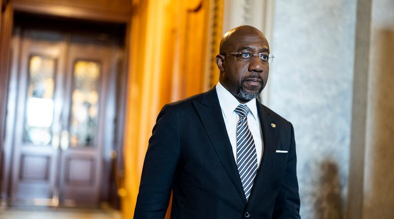 In this photo of May 11, 2022, Sen. Raphael Warnock (D-GA) walks out of the Senate Chambers during a series of votes in the U.S. Capitol Building in Washington, DC. (Anna Moneymaker/Getty Images/TNS)