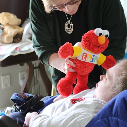 Sarah Smith needs round-the-clock care because of a rare genetic disorder called Dravet syndrome. Her mother, Sandra Smith, worries potential cuts to Medicaid funding could mean an end to the optional in-home care her Medicaid program covers. (Bram Sable-Smith/KFF Health News/TNS)