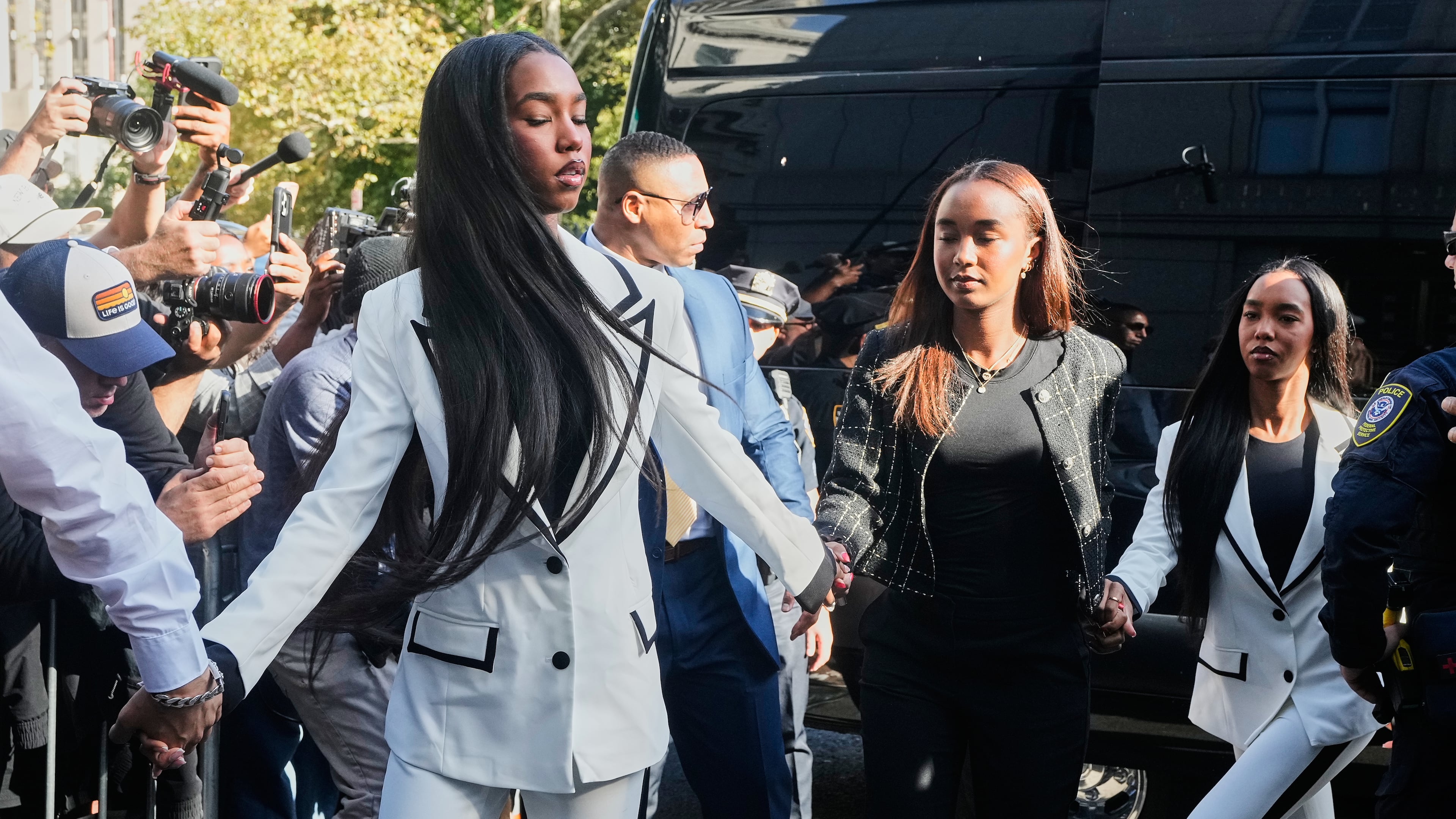 The twin daughters of Sean "Diddy" Combs, arrive at Federal Court, in New York, Friday, Oct. 3, 2025. (AP Photo/Richard Drew)