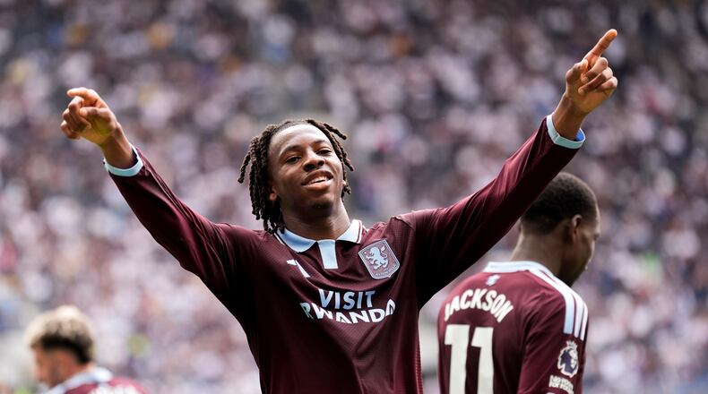 Aston Villa's Johan Manzambi celebrates as he scores the opening goal during the English Premier League soccer match between Tottenham Hotspur and Aston Villa, at Tottenham Hotspur Stadium in London, Saturday, Sept. 19, 2026. (Andrew Matthews/PA via AP)