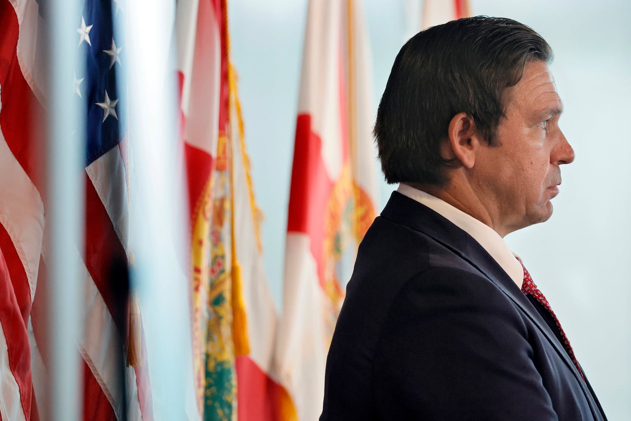 Gov. Ron DeSantis waits to speak during a news conference at Florida Atlantic University on June 26, 2025, where he announced a new accrediting body for public universities called the Commission for Public Higher Education. This new body doe not include any DEI requirements when conferring accreditation and has not yet been approved by the U.S. Department of Education. (Amy Beth Bennett/South Florida Sun Sentinel/TNS)