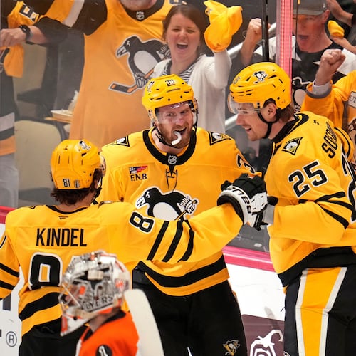 Pittsburgh Penguins' Elmer Soderblom (25) celebrates with Ben Kindel (81) and Anthony Mantha (39) after scoring against the Philadelphia Flyers during the first period of Game 5 in the first round of an NHL hockey Stanley Cup playoff series in Pittsburgh, Monday, April 27, 2026. (AP Photo/Gene J. Puskar)