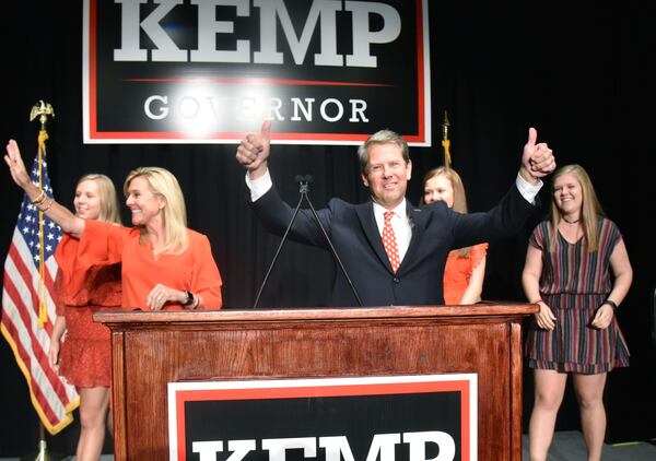 November 6, 2018 Athens - GOP gubernatorial candidate Brian Kemp gives thumbs up as he takes on stage with his family during his election watch party at The Classic Center in Athens on Tuesday, November 6, 2018. HYOSUB SHIN / HSHIN@AJC.COM