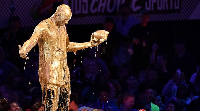 Retired NBA All-Star Kobe Bryant accepts the Legend Award and gets slimed onstage during the 2016 Nickelodeon Kids' Choice Sports Awards.