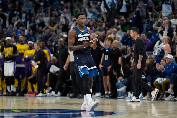 Minnesota Timberwolves guard Anthony Edwards (5) celebrates after making a 3-point shot during the second half of Game 4 of an NBA basketball first-round playoff series against the Los Angeles Lakers, Sunday, April 27, 2025, in Minneapolis. (AP Photo/Abbie Parr)