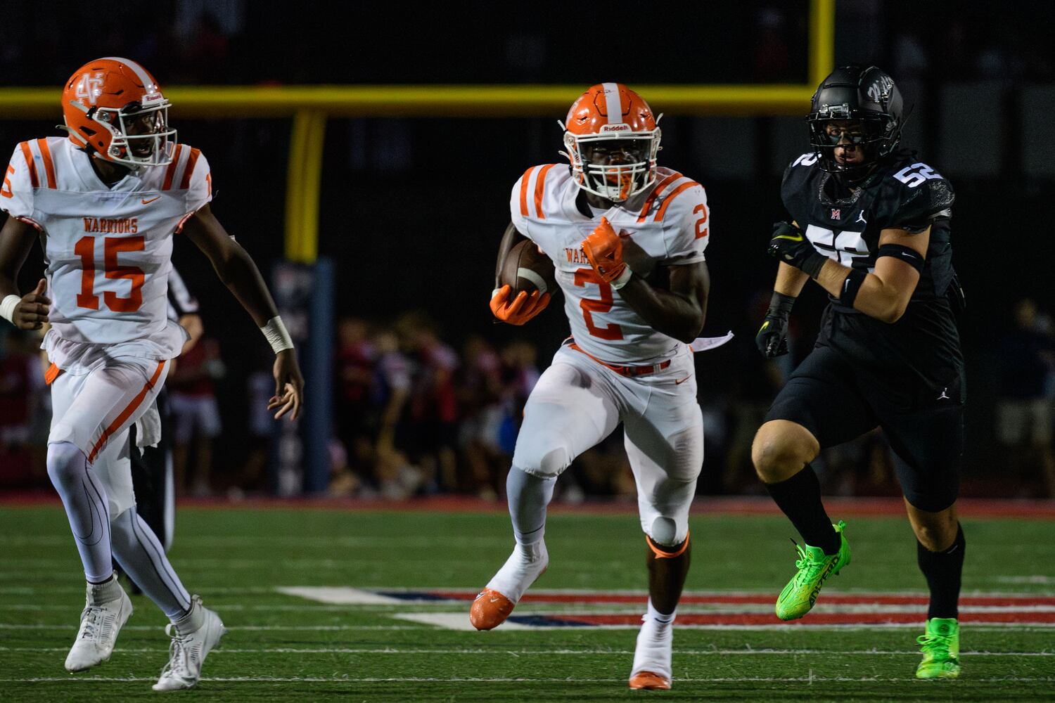 North Cobb running back David Eziomume heads downfield on a carry during Friday's high school game against Milton. (Jamie Spaar for the Atlanta Journal Constitution)