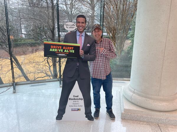 WSB Radio host Mark Arum poses with his cardboard TV buddy Fred Blankenship.