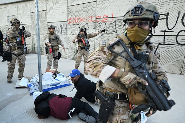 Members of the California National Guard surround demonstrators during protests on Thursday, June 12, 2025, in Los Angeles (AP Photo/Wally Skalij)