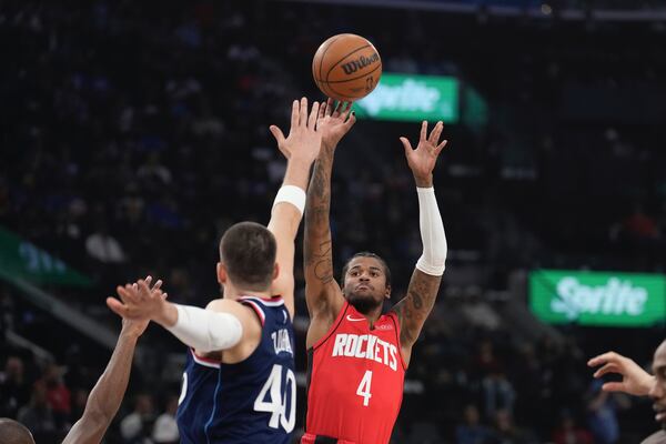 Houston Rockets guard Jalen Green, right, shoots as Los Angeles Clippers center Ivica Zubac defends during the first half of an NBA basketball game Wednesday, April 9, 2025, in Inglewood, Calif. (AP Photo/Mark J. Terrill)