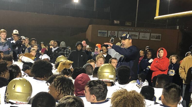 Daula coach Clint Jenkins talks to his team after their win over Lanier.