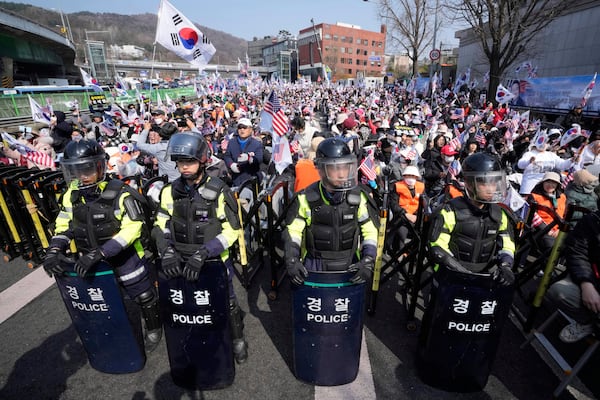 Supporters of impeached South Korean President Yoon Suk Yeol stage a rally to oppose his impeachment near the presidential residence in Seoul, South Korea, Friday, April 4, 2025. (AP Photo/Ahn Young-joon)
