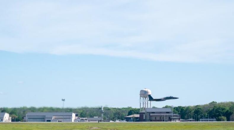An F-15, flown by Air Force Reserve Maj. Scott Smith, takes off at Robins Air Force Base, Georgia. An Air Force contractor suspected of having medical complications related to the coronavirus has died.