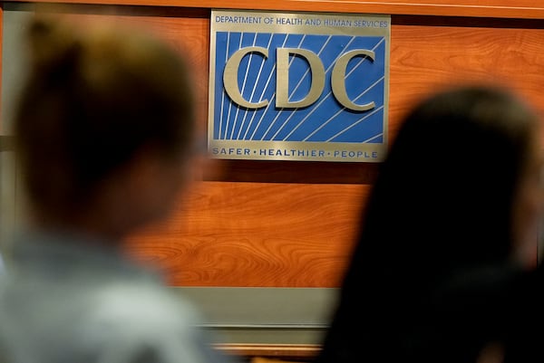 Participants listen during a meeting of the Advisory Committee in Immunization Practices at the CDC, Wednesday, June 25, 2025, in Atlanta. (AP Photo/Mike Stewart)