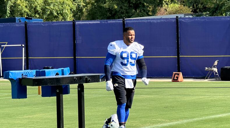 Aaron Donald takes the field for practice at the Los Angeles Rams' training complex in Los Angeles, Sunday, Aug. 30, 2026. (AP Photo/Greg Beacham)