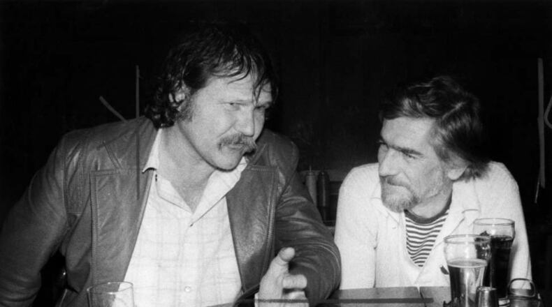 Writers Harry Crews and Paul Hemphill at Manuel's Tavern on April 16, 1979. AJC File