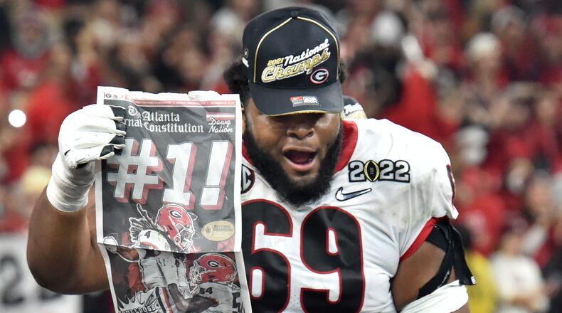 Georgia's offensive lineman Jamaree Salyer (69) celebrates after Georgia beat Alabama to win 2022 College Football Playoff National Championship at Lucas Oil Stadium in Indianapolis on Monday, Jan. 10, 2022. (Hyosub Shin / Hyosub.Shin@ajc.com)