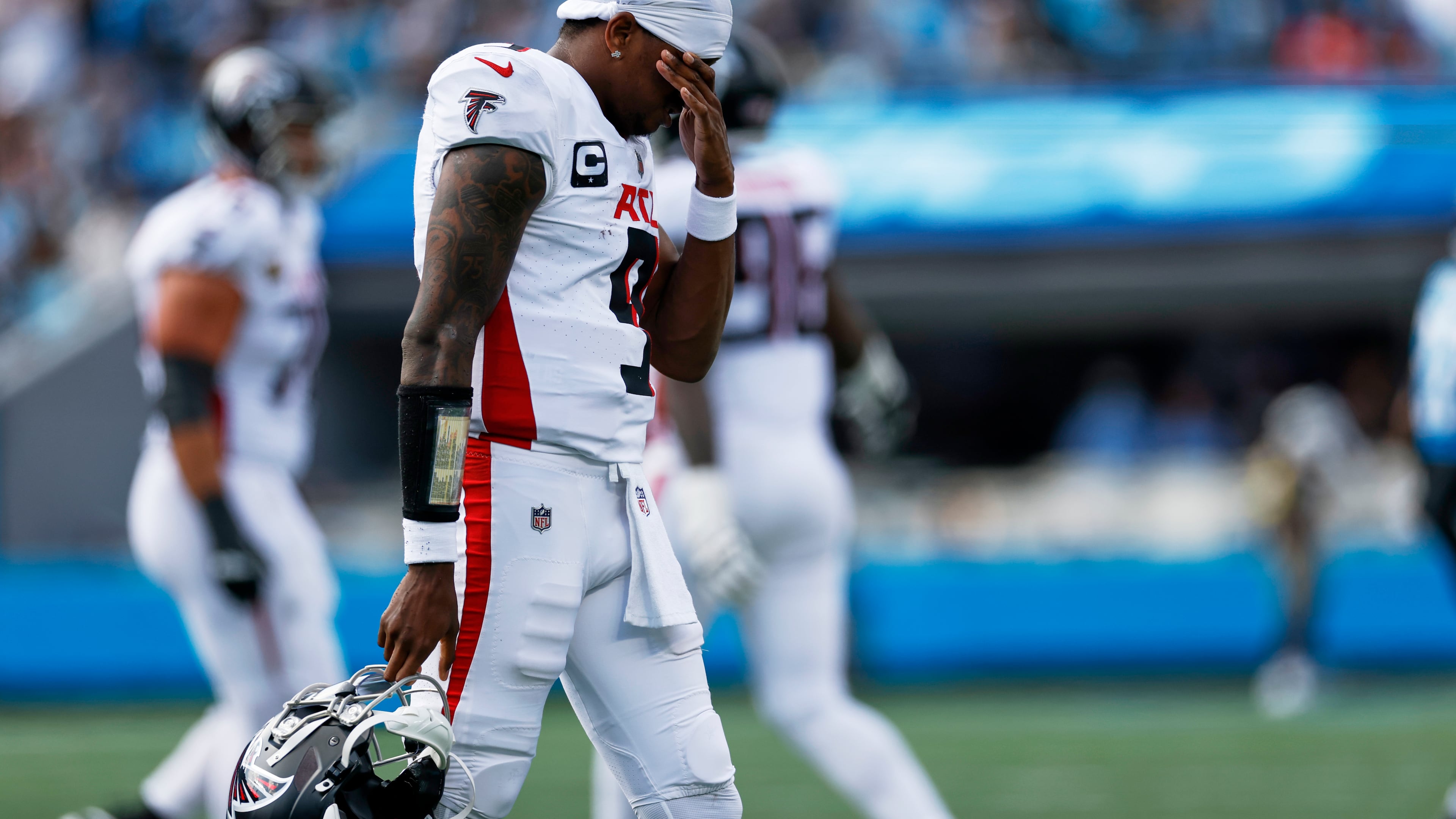 Atlanta Falcons quarterback Michael Penix Jr. walks to the sideline during the second half of an NFL football game against the Carolina Panthers, Sunday, Sept. 21, 2025, in Charlotte, N.C. (AP Photo/Rusty Jones)