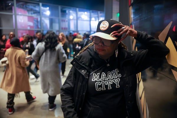Atlanta Hawks fan Jazmine Rose, of Atlanta, poses for a photograph wearing a Magic City sweatshirt before the NBA game against the Orlando Magic at State Farm Arena, Monday, March 16, 2026, in Atlanta. (Jason Getz/AJC)