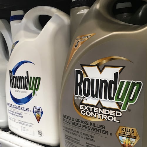 FILE - Containers of Roundup are displayed for sale on a store shelf in San Francisco, Feb. 24, 2019. (AP Photo/Haven Daley, File)