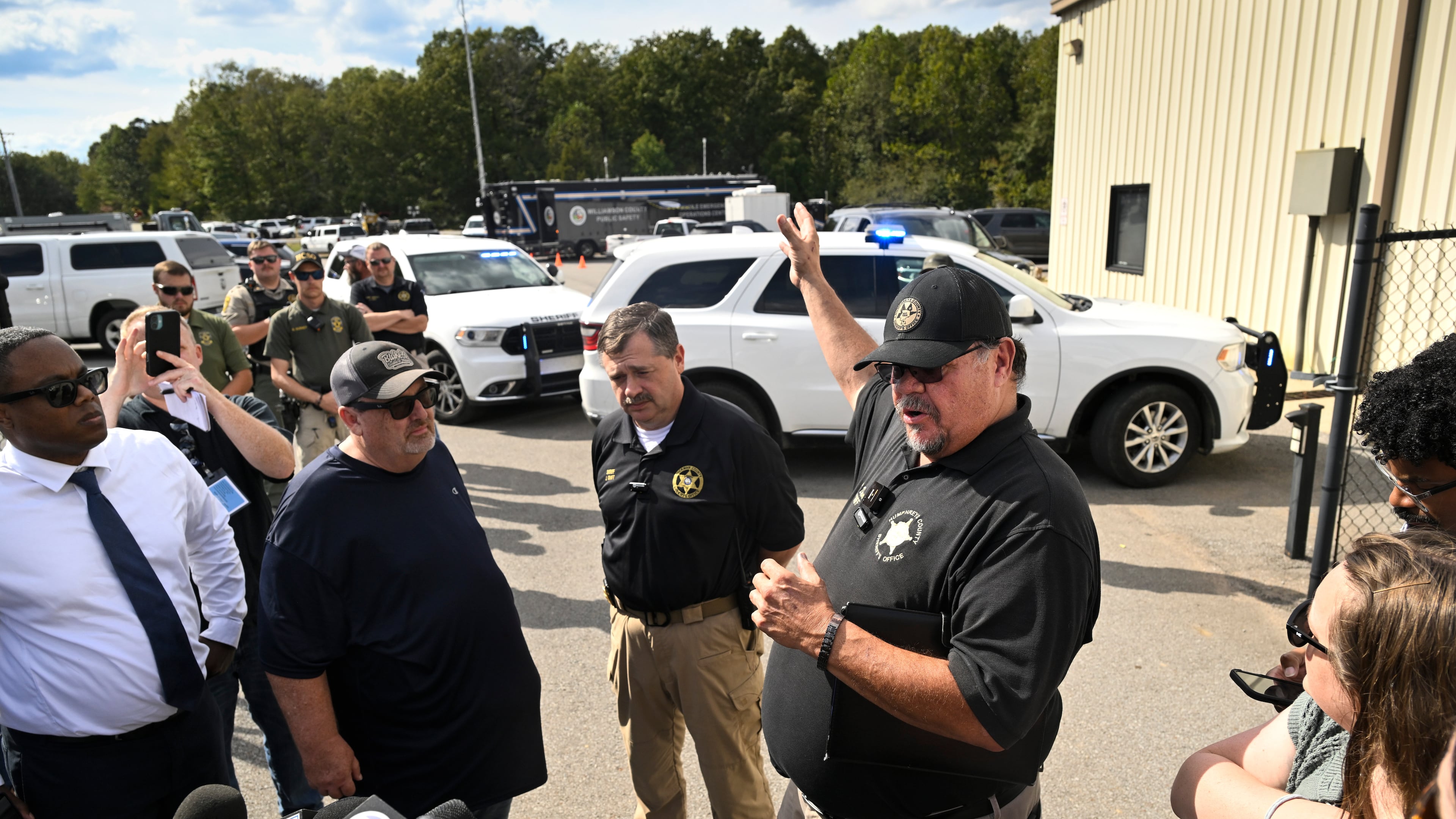 Humphreys County Sheriff Chris Davis, right, stands next to Hickman County Sheriff J. Craft as they address the press during a news conference at Accurate Energetic Systems, an explosives plant, after a blast resulted in multiple fatalities and others missing Friday, Oct. 10, 2025, in Bucksnort, Tenn. (AP Photo/John Amis)