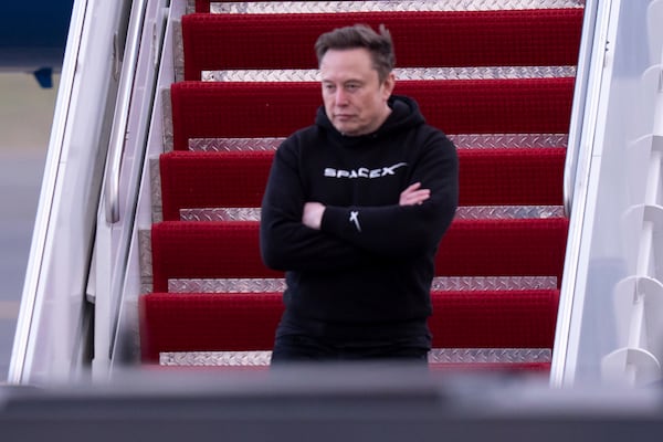 FILE - Elon Musk arrives on Air Force One at Philadelphia International Airport, March 22, 2025, in Philadelphia. (AP Photo/Chris Szagola, File)