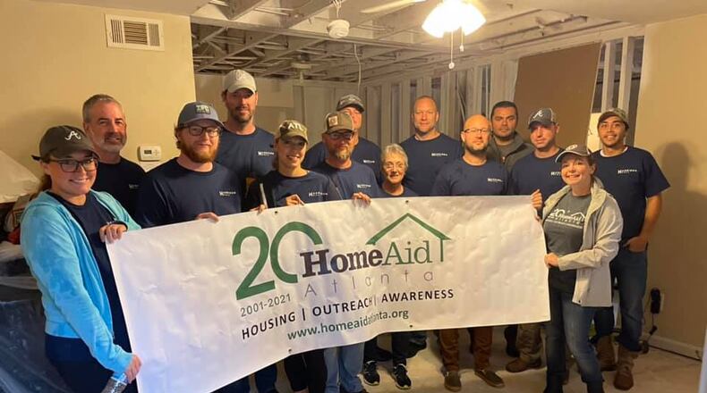 HomeAid Atlanta volunteers from Harrison Homes completed interior demolition at The Drake House in Roswell before plumbing work begins. (Courtesy HomeAid Atlanta)