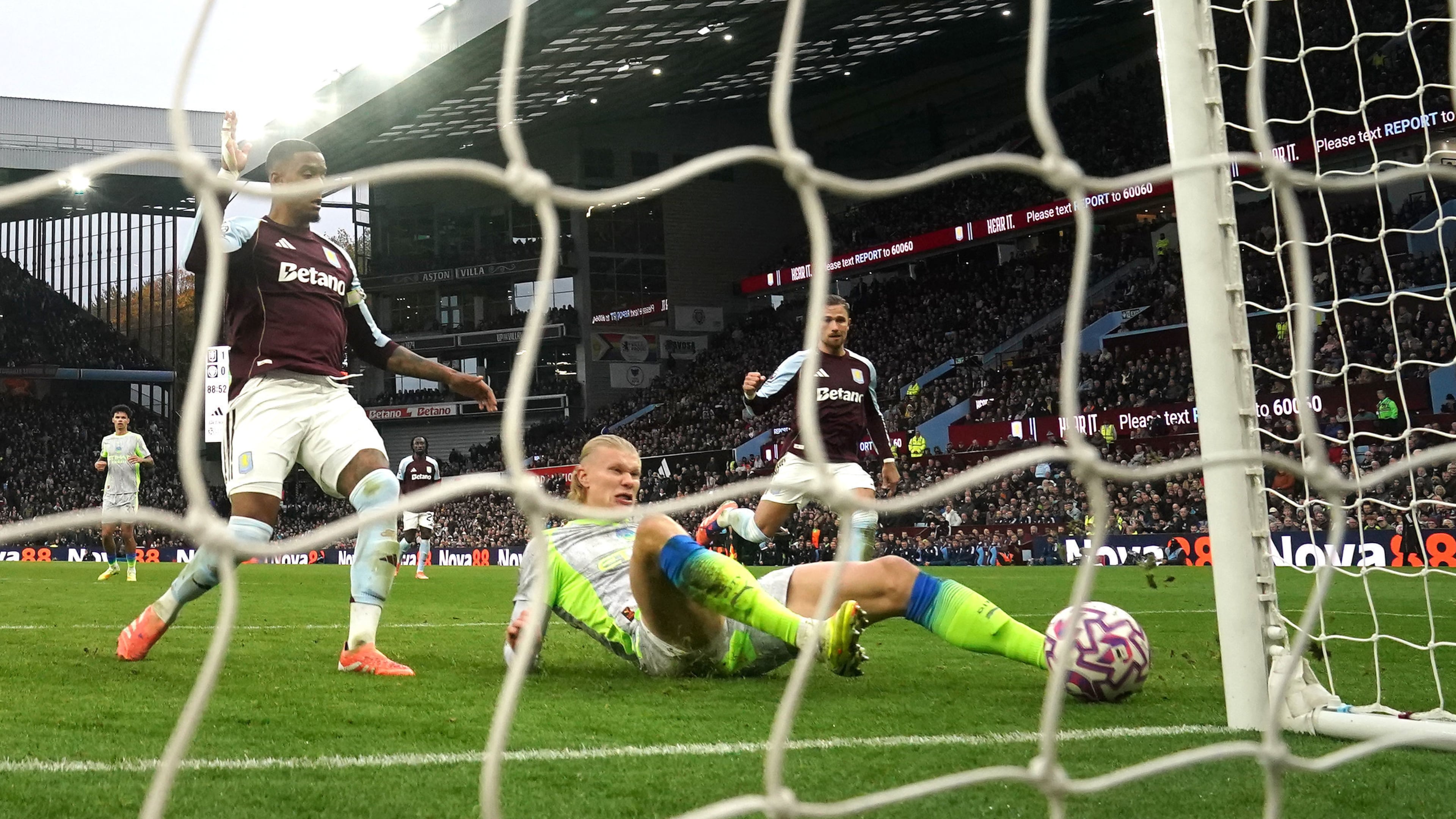 Manchester City's Erling Haaland scores a goal before being ruled out for offside via VAR during the English Premier League match between Aston Villa and Manchester City, in Birmingham, England, Sunday Oct. 26, 2025. (Nick Potts/PA via AP)
