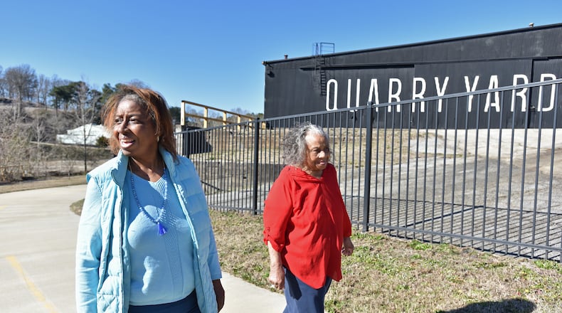 Genia Billingsley and her mother Thelma take a walk near the Quarry Yards development in Atlanta's Grove Park neighborhood. Microsoft plans to bring thousands of jobs to a new campus there. (Hyosub Shin / Hyosub.Shin@ajc.com)
