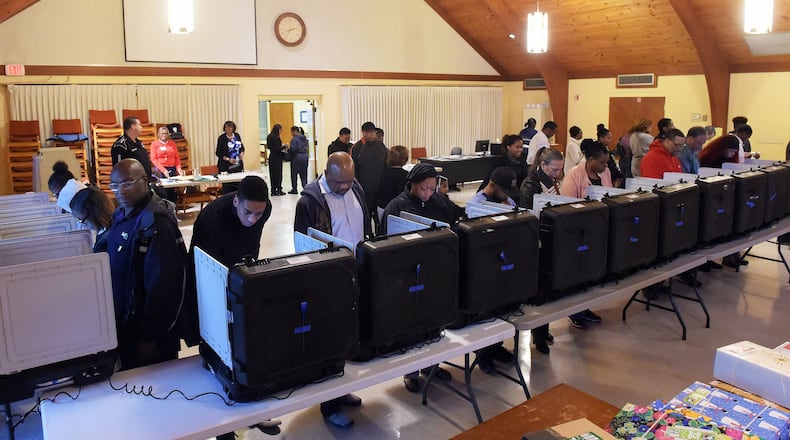 DeKalb County voters go to the polls on Election Day in November 2016 at the Crossroads Presbyterian Church in Stone Mountain. KENT D. JOHNSON / KDJOHNSON@AJC.com
